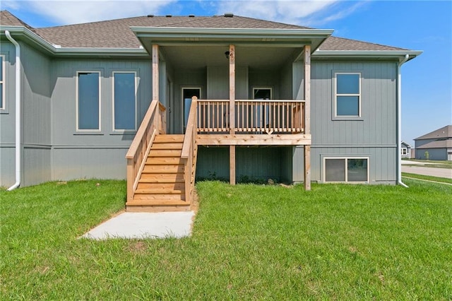 3707 NE 90th St, Kansas City, MO 64156 - back of property featuring roof with shingles, a yard, and stairway