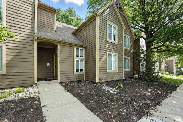 11134 Nieman Rd Unit 201, Overland Park, KS 66210 - doorway to property with a shingled roof