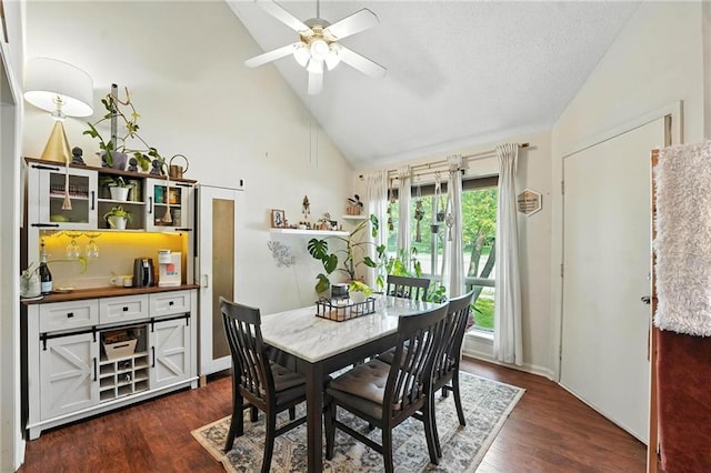 11134 Nieman Rd Unit 201, Overland Park, KS 66210 - dining space featuring ceiling fan, dark wood finished floors, and high vaulted ceiling