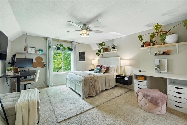 11134 Nieman Rd Unit 201, Overland Park, KS 66210 - bedroom with light carpet, a textured ceiling, vaulted ceiling, and a ceiling fan