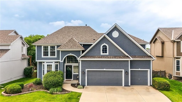 22833 W 44th St, Shawnee, KS 66226 - traditional home with stucco siding, driveway, a shingled roof, and a garage