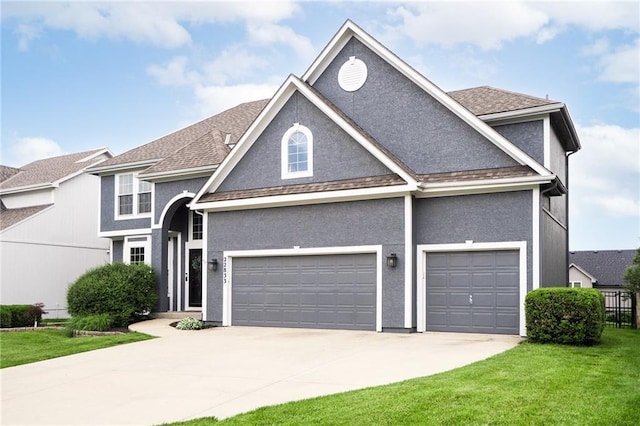 22833 W 44th St, Shawnee, KS 66226 - traditional-style house featuring concrete driveway, a front yard, stucco siding, and roof with shingles