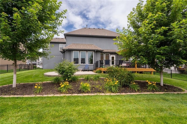 22833 W 44th St, Shawnee, KS 66226 - rear view of property with a wooden deck, a shingled roof, and a patio area