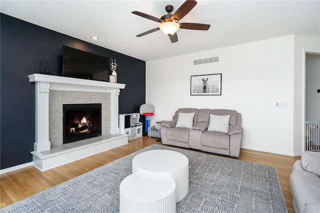 22833 W 44th St, Shawnee, KS 66226 - living room featuring wood finished floors, a ceiling fan, a fireplace, and recessed lighting