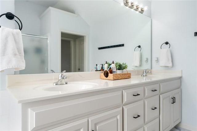 22833 W 44th St, Shawnee, KS 66226 - full bathroom with double vanity, a stall shower, and lofted ceiling
