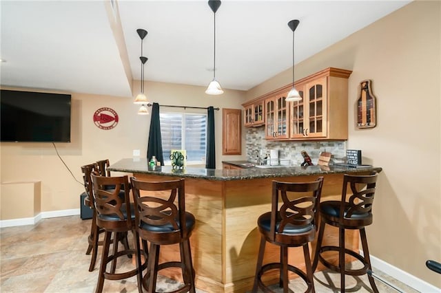 22833 W 44th St, Shawnee, KS 66226 - indoor wet bar featuring backsplash and pendant lighting
