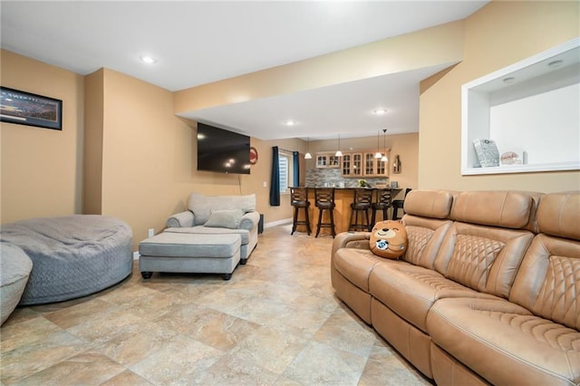 22833 W 44th St, Shawnee, KS 66226 - living room featuring light stone finish floors, bar, and recessed lighting