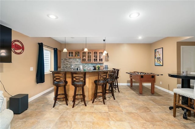 22833 W 44th St, Shawnee, KS 66226 - indoor wet bar with light stone finish floors, pendant lighting, tasteful backsplash, and recessed lighting