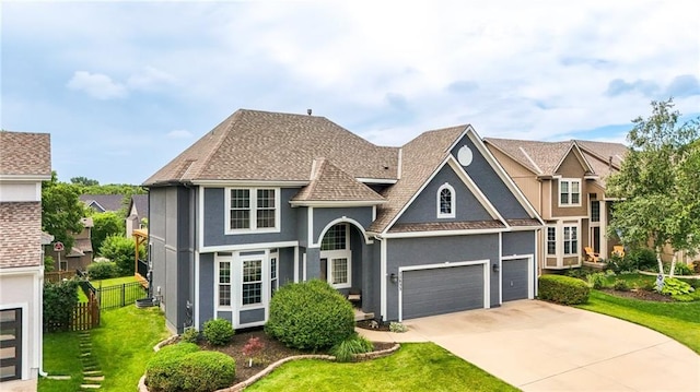 22833 W 44th St, Shawnee, KS 66226 - view of front of home with stucco siding, driveway, an attached garage, and a shingled roof