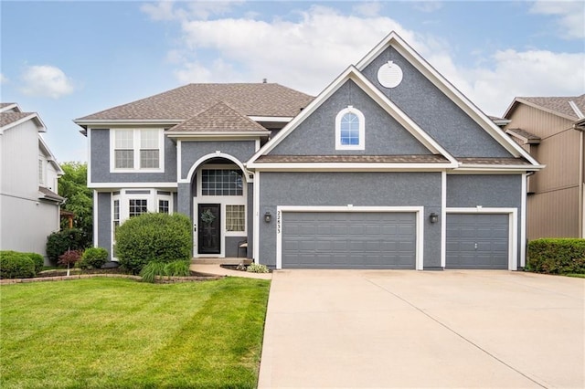 22833 W 44th St, Shawnee, KS 66226 - view of front facade featuring driveway, a front lawn, stucco siding, an attached garage, and roof with shingles