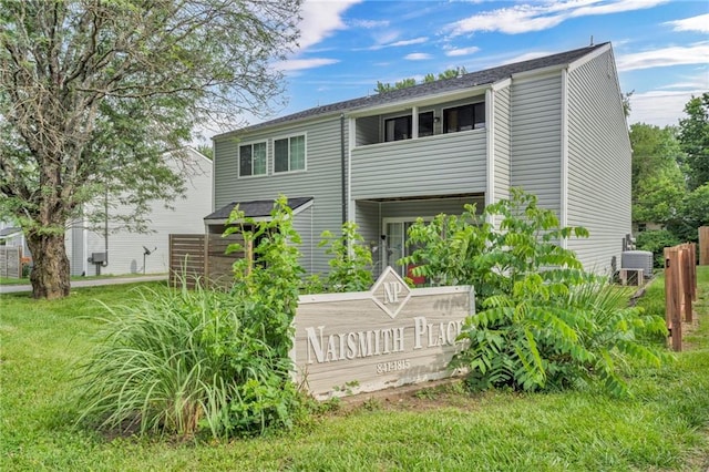 1509 W 25th Ct Unit A2, Lawrence, KS 66046 - rear view of house with a lawn
