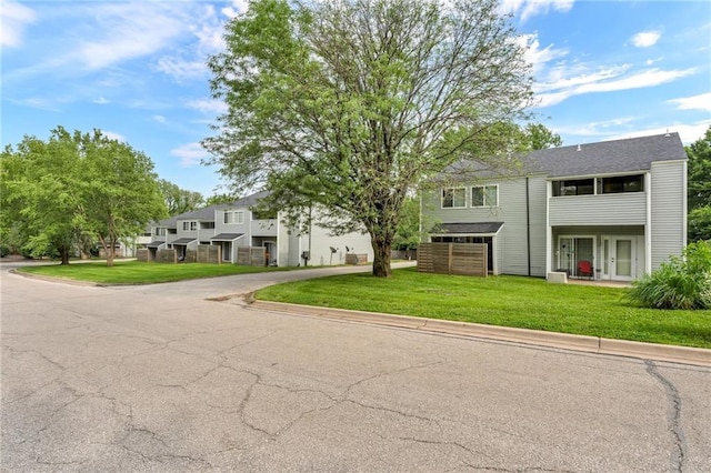 1509 W 25th Ct Unit A2, Lawrence, KS 66046 - townhome / multi-family property featuring a front lawn