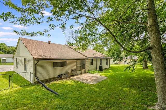 7306 N Holmes Ave, Gladstone, MO 64118 - rear view of property with a gate, a shingled roof, a patio area, and a yard
