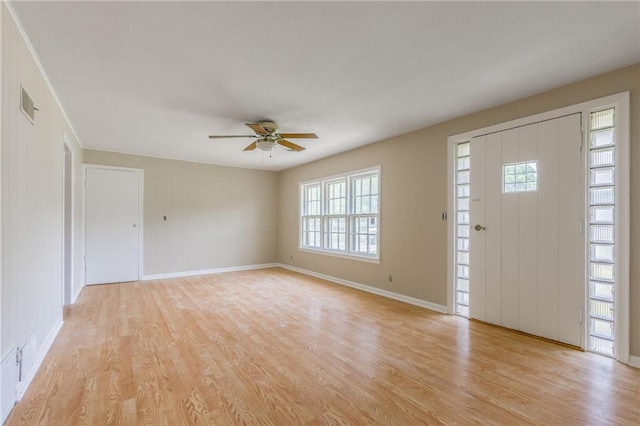 7306 N Holmes Ave, Gladstone, MO 64118 - entrance foyer with light wood-style flooring and a ceiling fan