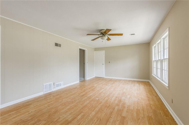 7306 N Holmes Ave, Gladstone, MO 64118 - spare room with ceiling fan and light wood-style flooring