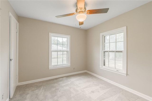 7306 N Holmes Ave, Gladstone, MO 64118 - unfurnished room featuring light colored carpet and a ceiling fan