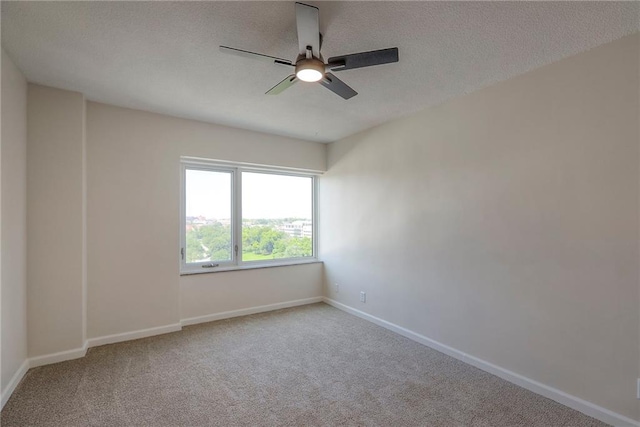4545 Wornall Rd Unit 1009, Kansas City, MO 64111 - carpeted empty room featuring a ceiling fan and a textured ceiling