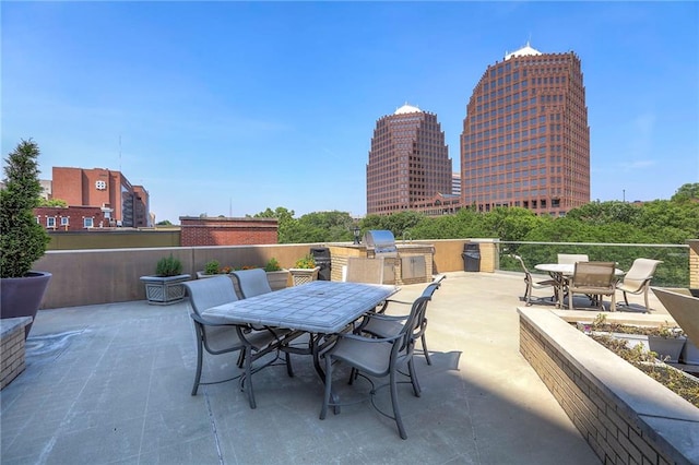 4545 Wornall Rd Unit 1009, Kansas City, MO 64111 - view of patio / terrace featuring outdoor dining area and exterior kitchen