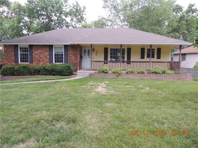 326 Virginia Rd, Excelsior Springs, MO 64024 - ranch-style house featuring covered porch, a front yard, roof with shingles, and brick siding