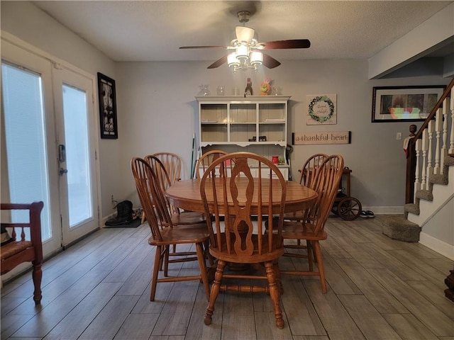 19400 E 13th St N, Independence, MO 64056 - dining room featuring wood finished floors, stairway, and a ceiling fan
