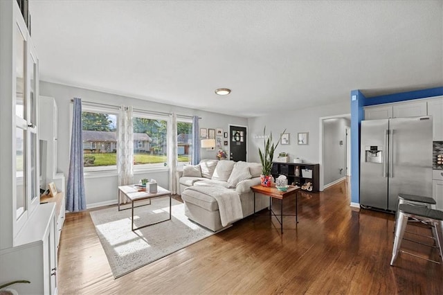 13500 Spring St, Grandview, MO 64030 - living room with wood finished floors and baseboards