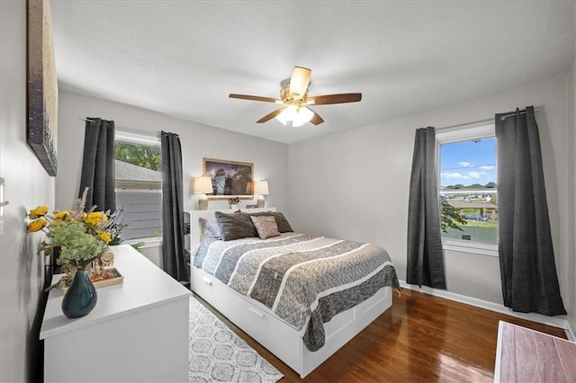 13500 Spring St, Grandview, MO 64030 - bedroom with wood finished floors and a ceiling fan