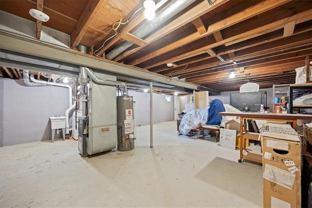 13500 Spring St, Grandview, MO 64030 - unfinished below grade area featuring water heater and heating unit
