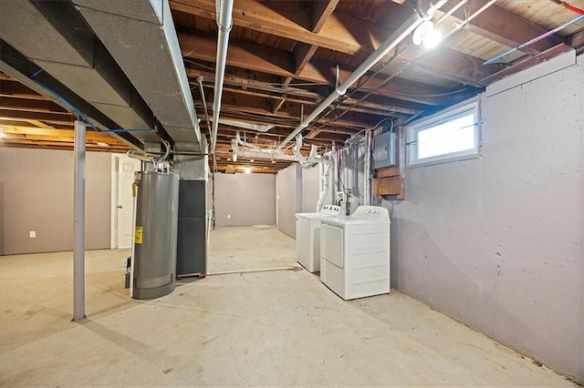 13500 Spring St, Grandview, MO 64030 - below grade area featuring washer and clothes dryer and gas water heater