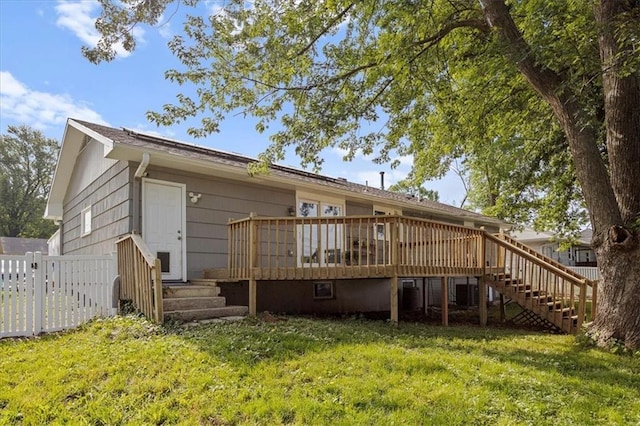 13500 Spring St, Grandview, MO 64030 - back of house with a wooden deck and stairway