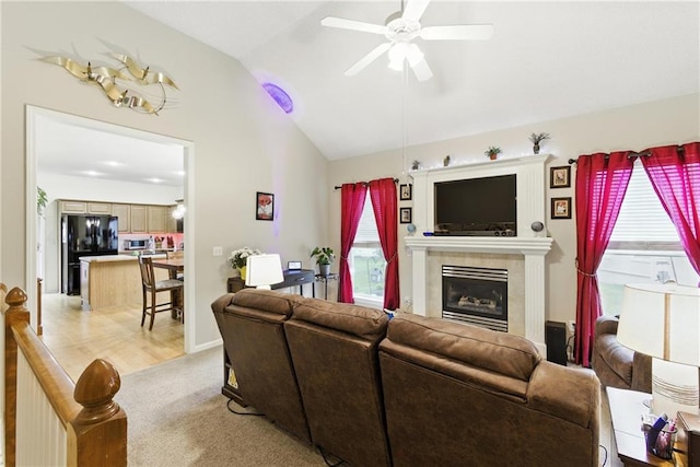 22802 W 72nd Ter, Shawnee, KS 66227 - living room featuring vaulted ceiling, ceiling fan, a fireplace, and light carpet