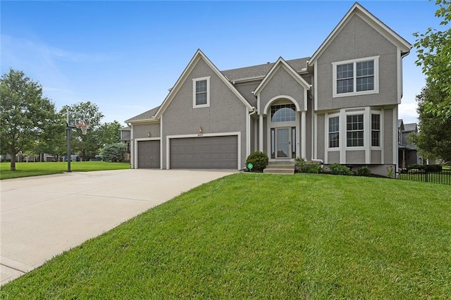 6017 Theden St, Shawnee, KS 66218 - traditional home with a garage, driveway, and stucco siding