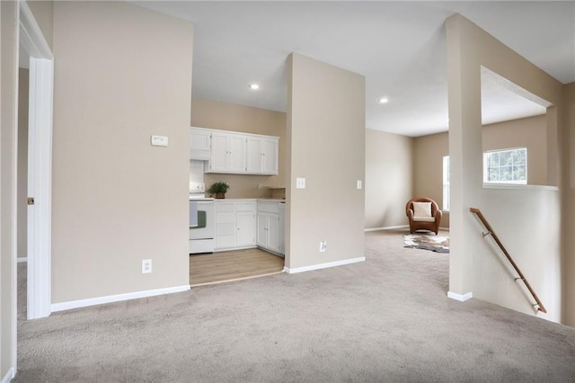 653 S Woodson Ln, Gardner, KS 66030 - unfurnished living room featuring light colored carpet and recessed lighting