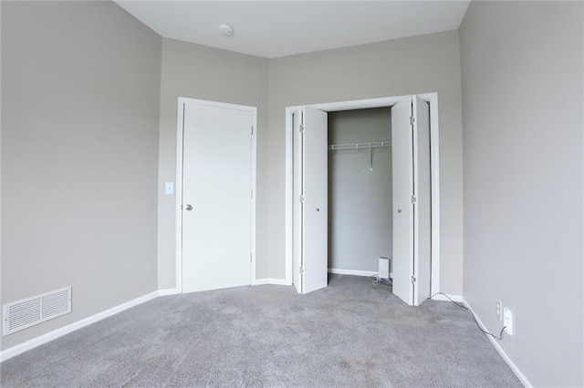 653 S Woodson Ln, Gardner, KS 66030 - unfurnished bedroom featuring carpet and a closet