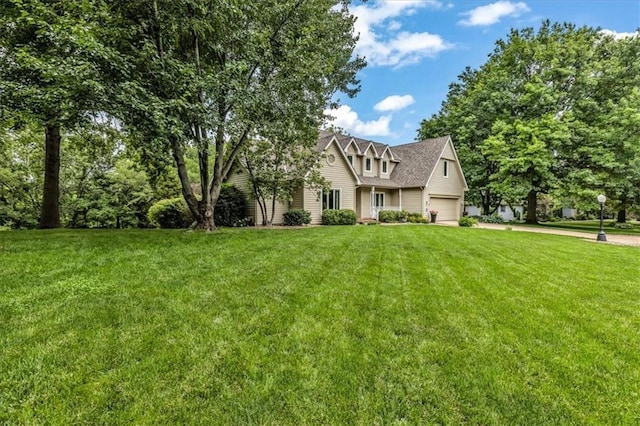 22810 SW Hampton Ct, Blue Springs, MO 64015 - obstructed view of property featuring a front lawn, roof with shingles, and an attached garage