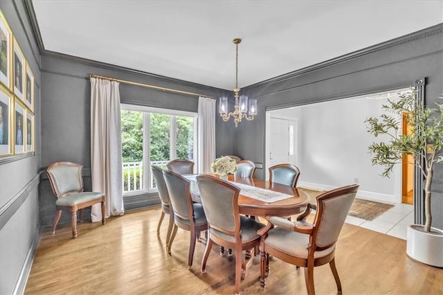 22810 SW Hampton Ct, Blue Springs, MO 64015 - dining space with a chandelier, light wood-type flooring, and ornamental molding
