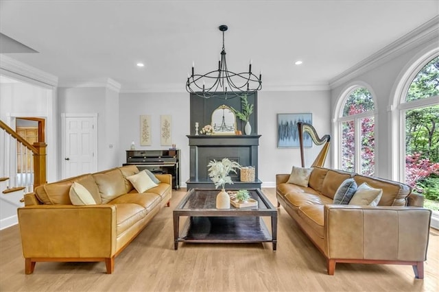 22810 SW Hampton Ct, Blue Springs, MO 64015 - living room with stairway, light wood-style floors, a chandelier, recessed lighting, and ornamental molding