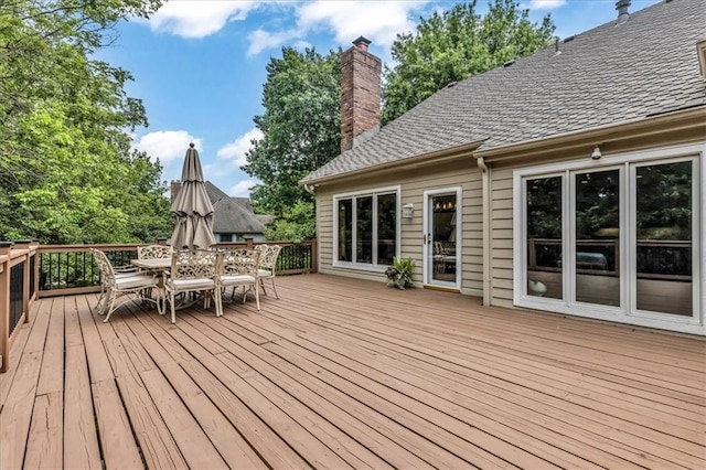 22810 SW Hampton Ct, Blue Springs, MO 64015 - wooden terrace with outdoor dining area
