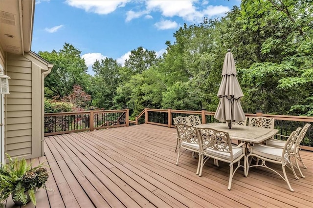 22810 SW Hampton Ct, Blue Springs, MO 64015 - wooden terrace with outdoor dining space and view of wooded area