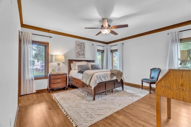 22810 SW Hampton Ct, Blue Springs, MO 64015 - bedroom featuring multiple windows, wood finished floors, and ornamental molding