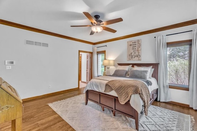 22810 SW Hampton Ct, Blue Springs, MO 64015 - bedroom featuring ornamental molding, wood finished floors, and a ceiling fan