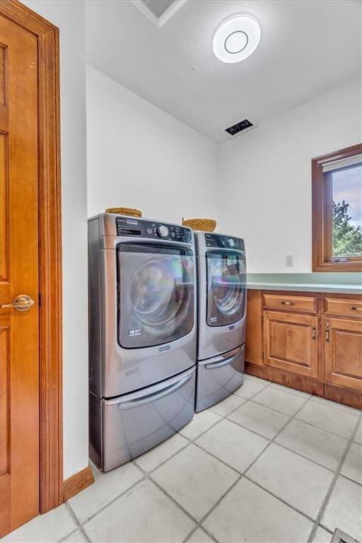22810 SW Hampton Ct, Blue Springs, MO 64015 - washroom with independent washer and dryer, cabinet space, and light tile patterned floors