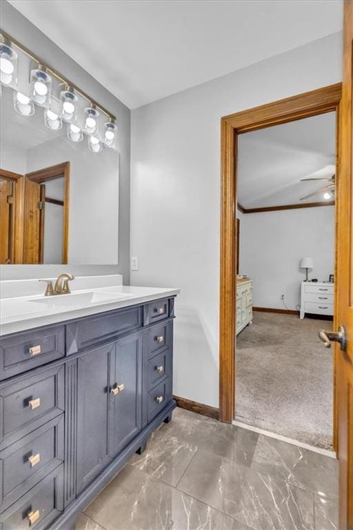 22810 SW Hampton Ct, Blue Springs, MO 64015 - bathroom featuring vanity, marble finish floors, and a ceiling fan