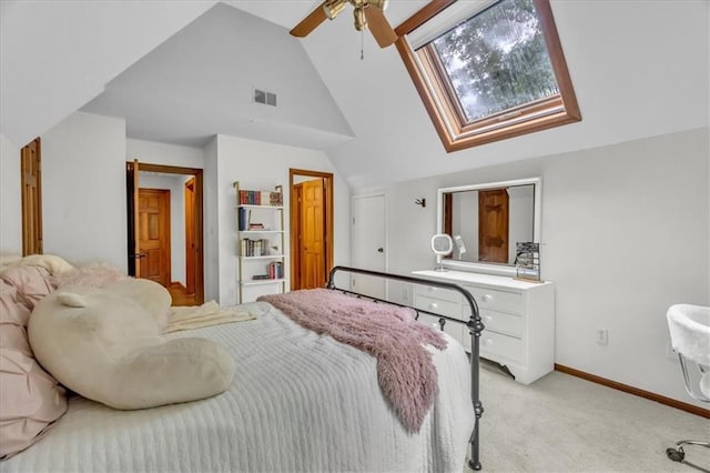 22810 SW Hampton Ct, Blue Springs, MO 64015 - bedroom with lofted ceiling, light carpet, a skylight, and a ceiling fan
