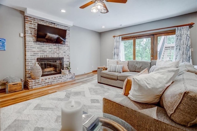 22810 SW Hampton Ct, Blue Springs, MO 64015 - living room with wood finished floors, ceiling fan, a fireplace, and recessed lighting