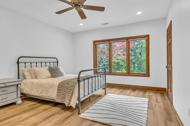 22810 SW Hampton Ct, Blue Springs, MO 64015 - bedroom with light wood-style floors, recessed lighting, and ceiling fan