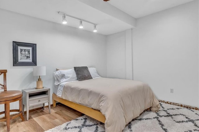 22810 SW Hampton Ct, Blue Springs, MO 64015 - bedroom featuring track lighting and wood finished floors