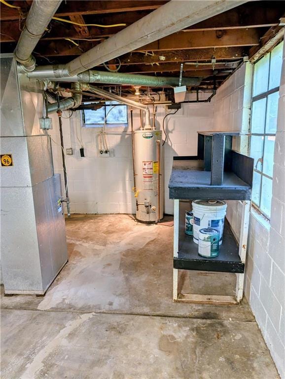 830 Locust St, Eudora, KS 66025 - below grade area featuring gas water heater, heating unit, and healthy amount of natural light