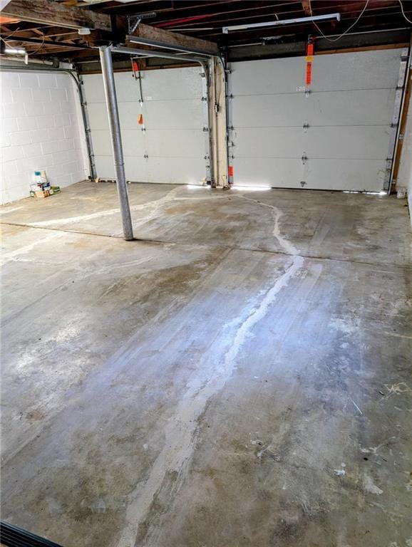 830 Locust St, Eudora, KS 66025 - garage featuring concrete block wall