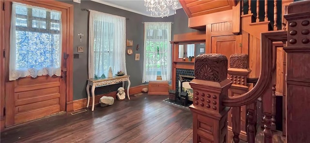 615 N Jefferson St, Carrollton, MO 64633 - home office featuring a chandelier, dark wood-type flooring, and ornamental molding