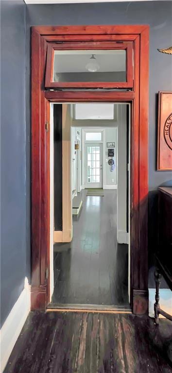 615 N Jefferson St, Carrollton, MO 64633 - corridor featuring wood finished floors and baseboards